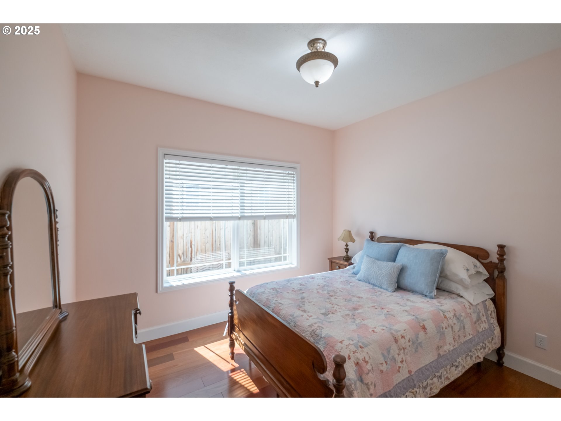 1435 Northwest Ashley Drive Albany, OR 97321 - Photo 20 of 44 a bedroom with a bed and a window