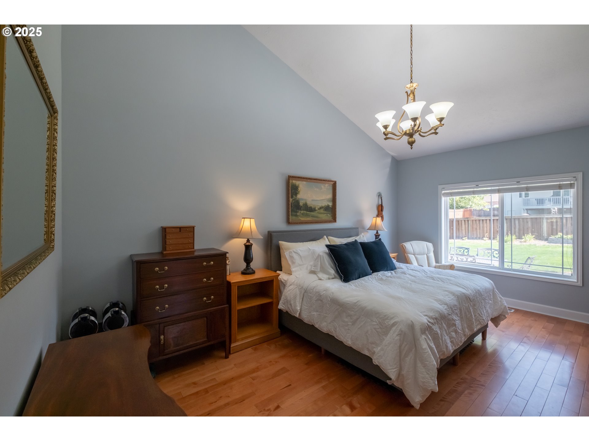 1435 Northwest Ashley Drive Albany, OR 97321 - Photo 21 of 44 a bedroom with a bed chandelier and a window