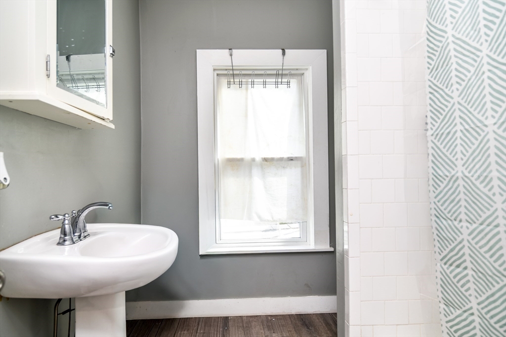 136 Commonwealth Road Wayland, MA 01778 - Photo 16 of 27 a bathroom with a sink and a window