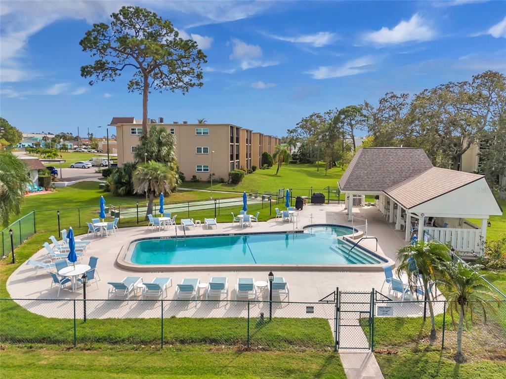 1430 Heather Ridge Boulevard, Unit 304 Dunedin, FL 34698 - Photo 23 of 36 a view of a house with a yard