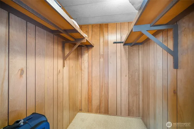 a view of a room with wooden walls