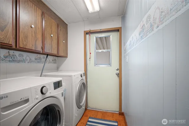 a view of storage and utility room with washer and dryer