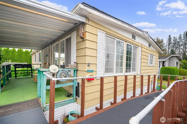 a view of balcony with two chairs and a table