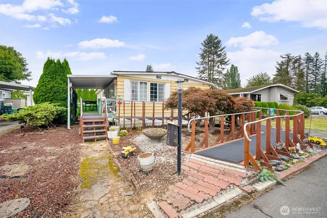 a view of a chair and tables in the patio