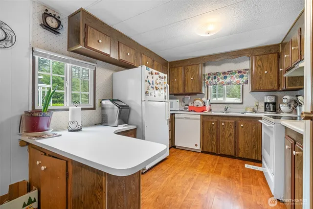 a kitchen with sink cabinets and window