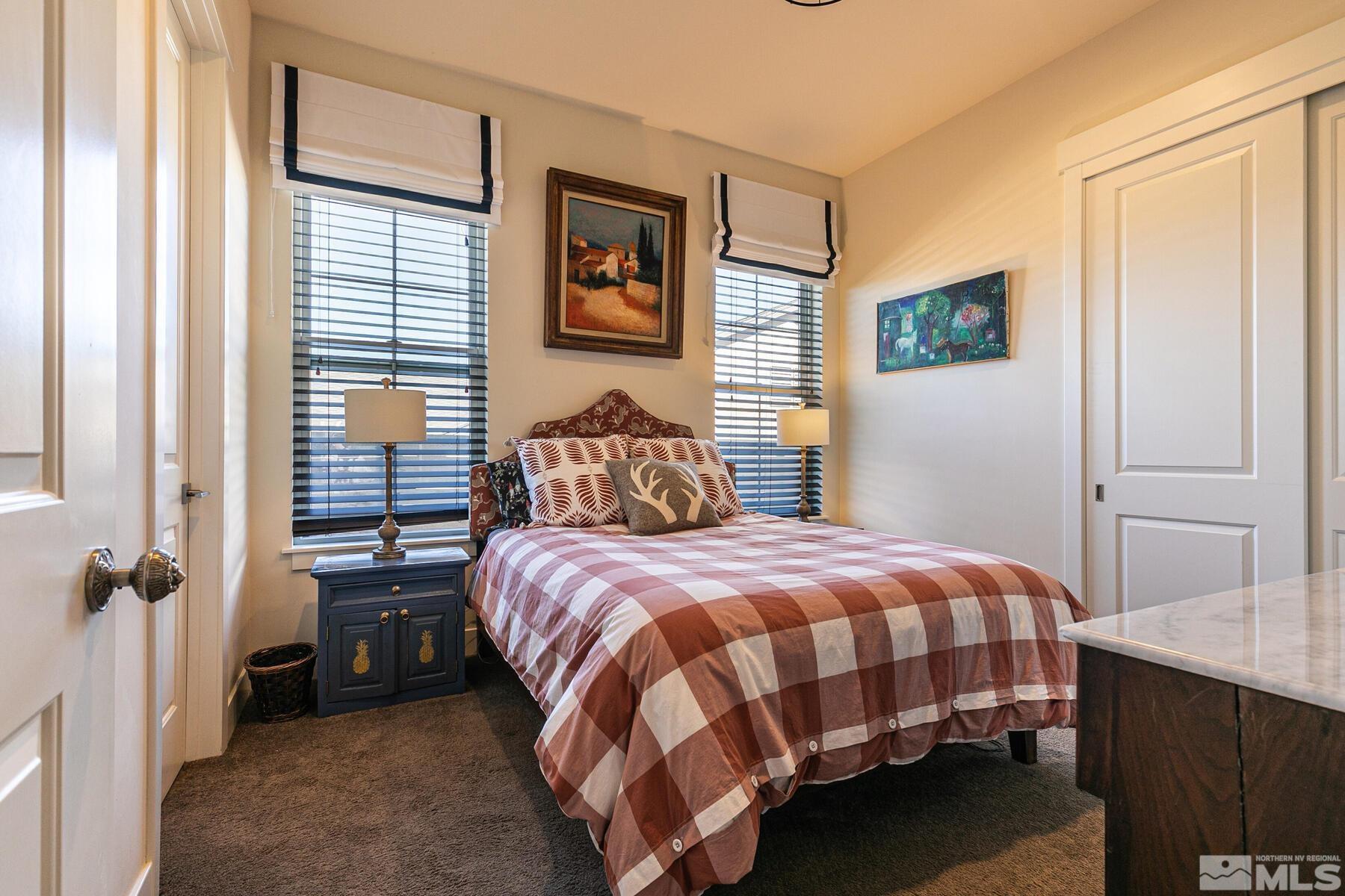 4104 Whispering Pine Loop Reno, NV 89519 - Photo 16 of 27 a bedroom with a bed and wooden floor
