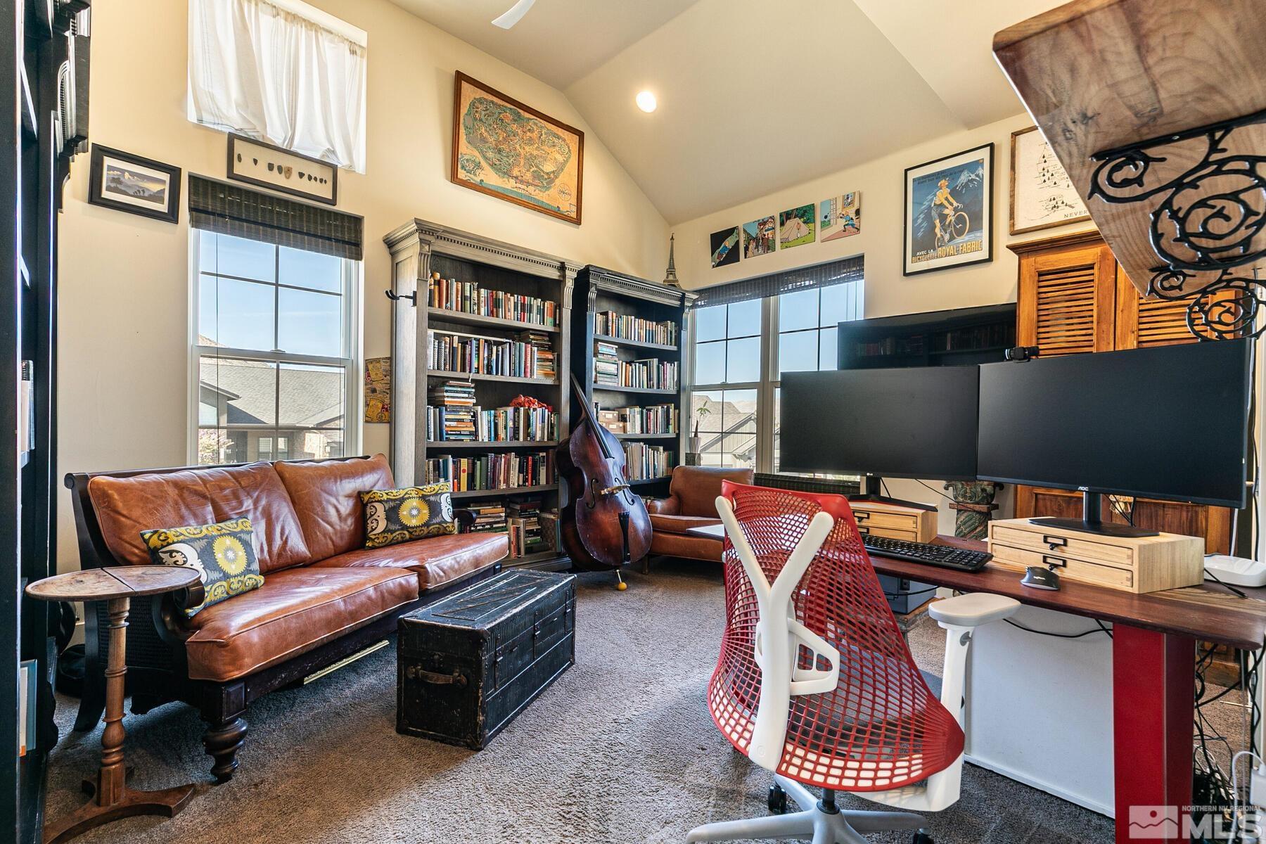 4104 Whispering Pine Loop Reno, NV 89519 - Photo 18 of 27 a living room with furniture workspace and a flat screen tv