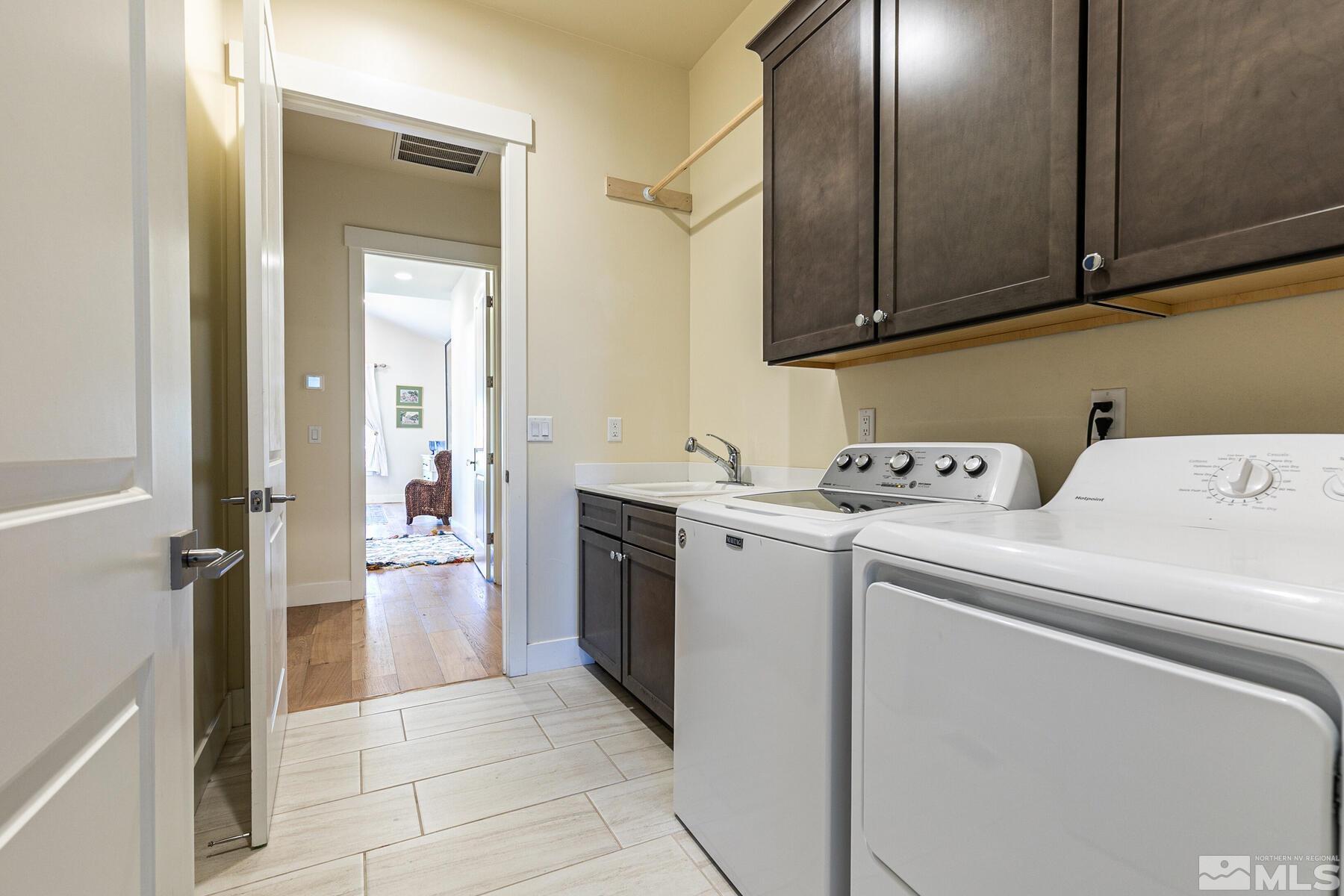 4104 Whispering Pine Loop Reno, NV 89519 - Photo 19 of 27 a utility room with dryer and washer