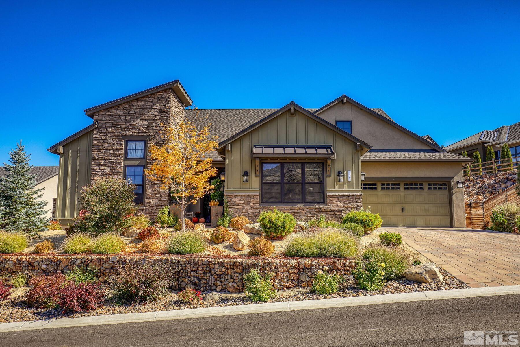 4104 Whispering Pine Loop Reno, NV 89519 - Photo 2 of 27 a front view of a house with garden
