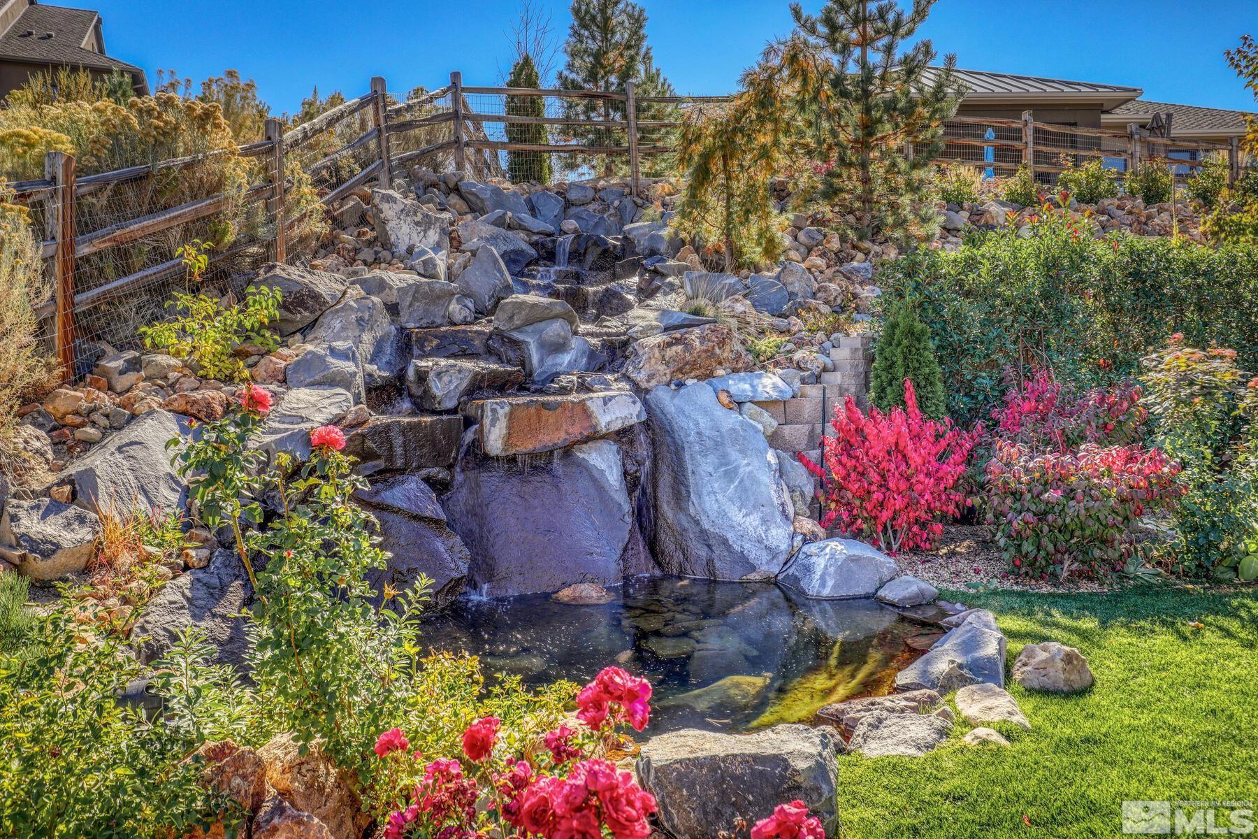 4104 Whispering Pine Loop Reno, NV 89519 - Photo 24 of 27 a view of a house with a yard and garden