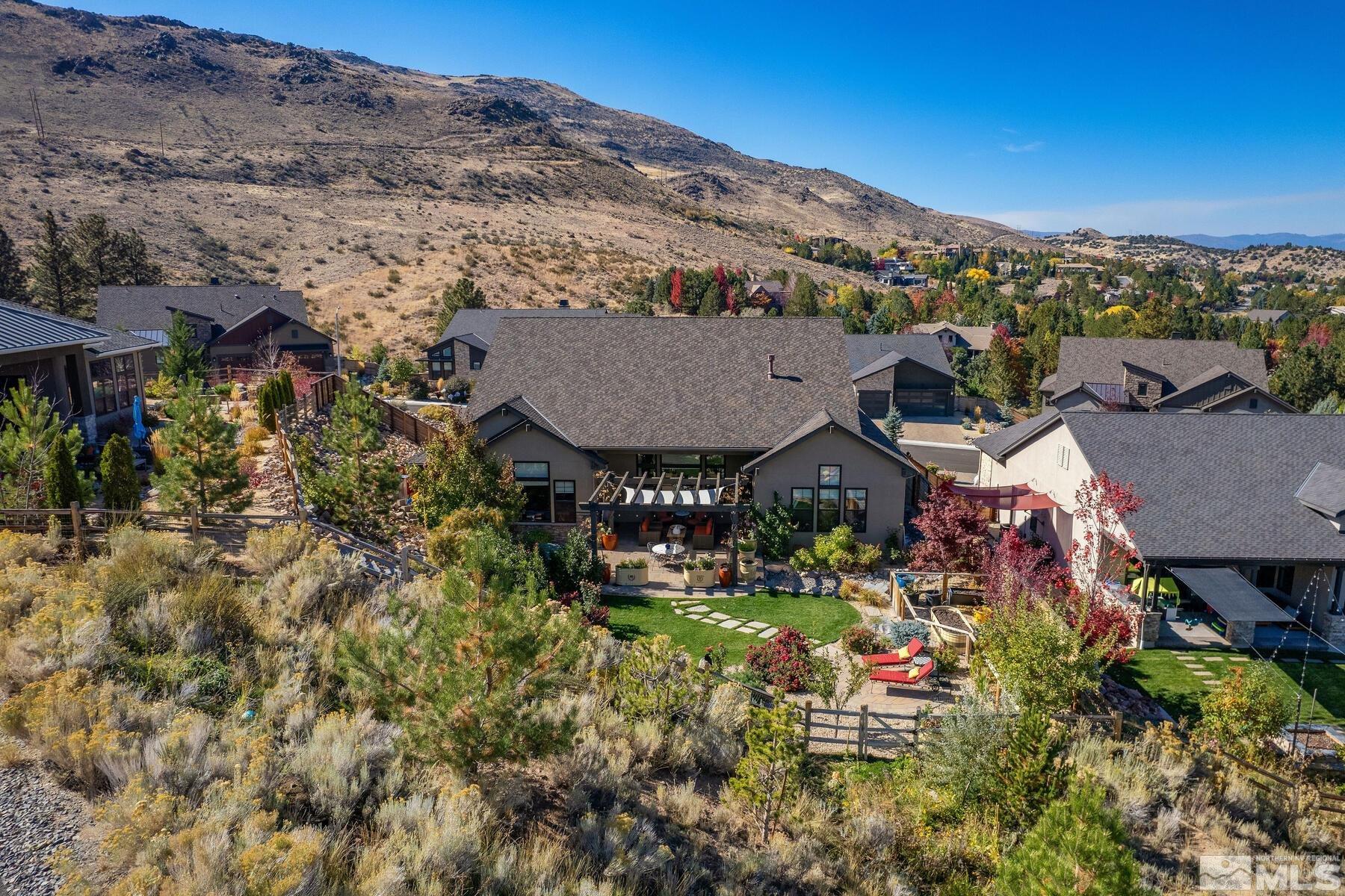4104 Whispering Pine Loop Reno, NV 89519 - Photo 25 of 27 a view of a house with a mountain in the background