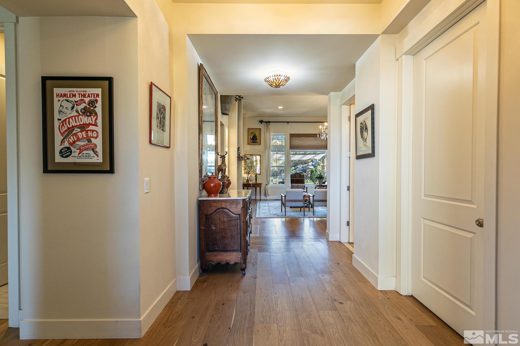4104 Whispering Pine Loop Reno, NV 89519 - Photo 5 of 27 a view of a hallway with wooden floor and furniture