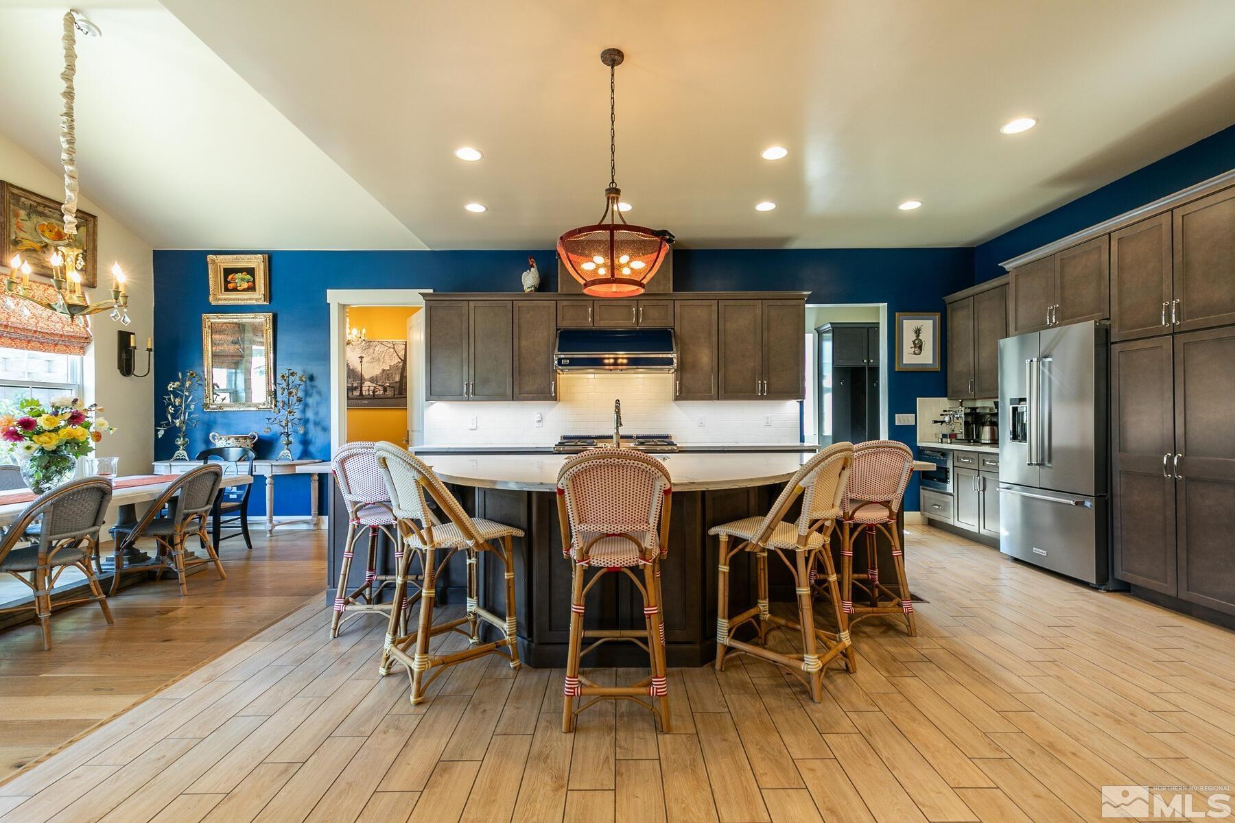 4104 Whispering Pine Loop Reno, NV 89519 - Photo 7 of 27 a view of a dining room with furniture window and wooden floor