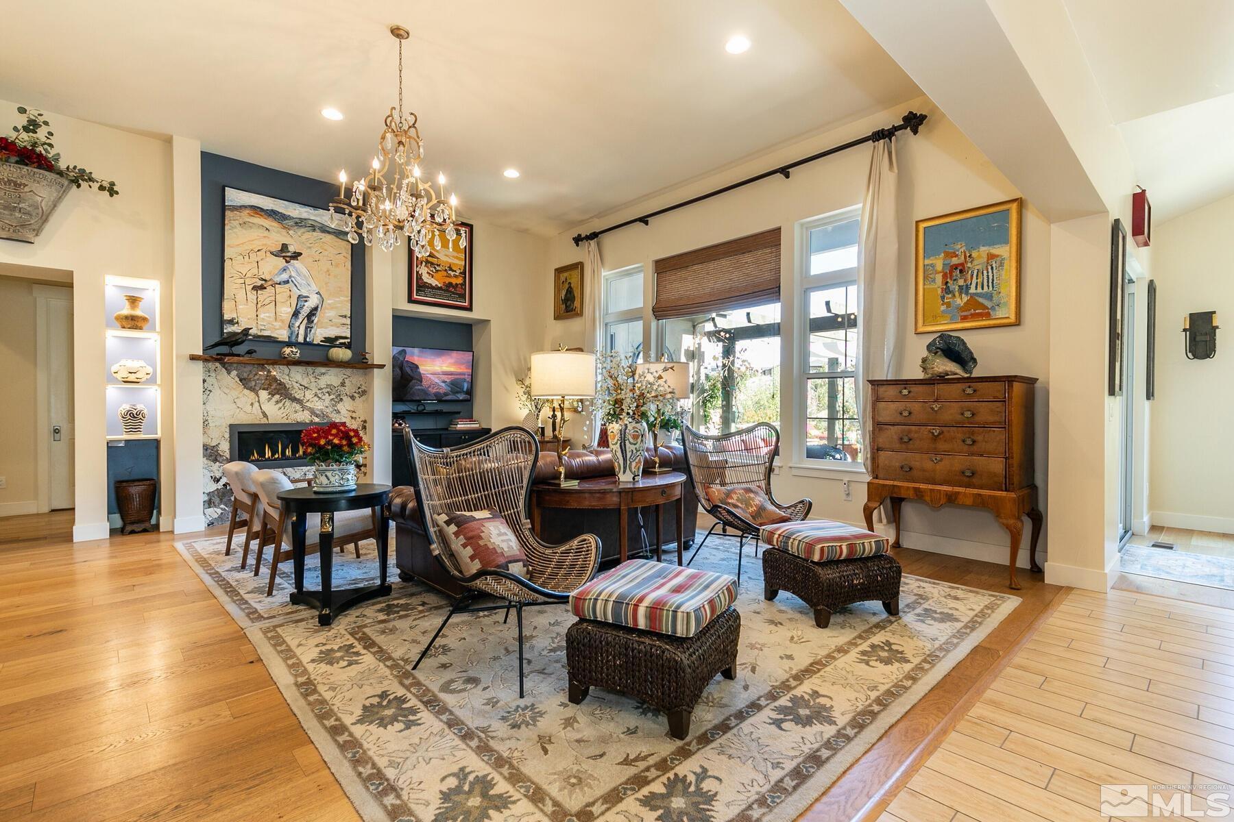 4104 Whispering Pine Loop Reno, NV 89519 - Photo 10 of 27 a living room with furniture and a chandelier