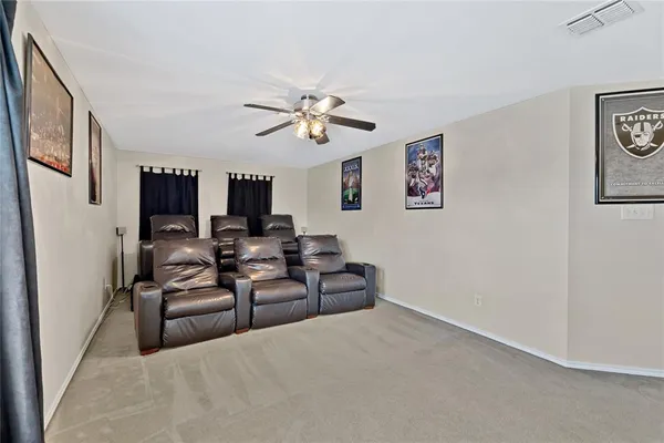 a living room with furniture flowerpot and a window