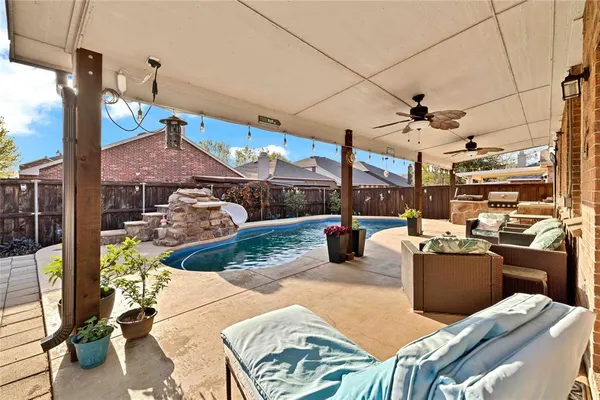 a view of a patio with couches chairs potted plants