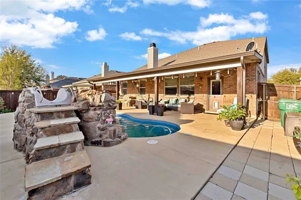 a view of a patio with couches and potted plants