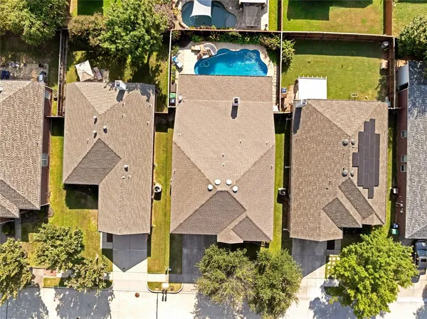 an aerial view of houses with outdoor space