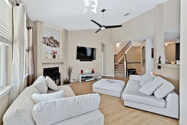 a living room with furniture fireplace and a flat screen tv