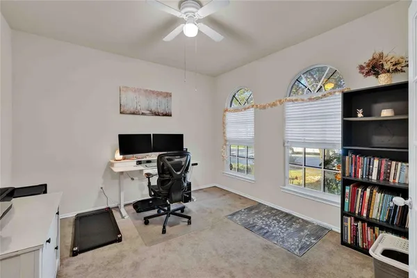 a workspace with a bookshelf
