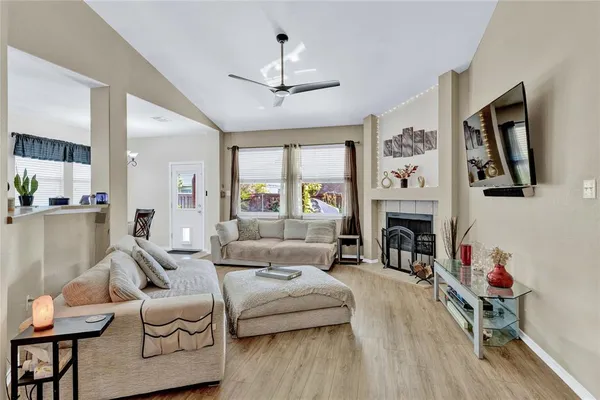a living room with furniture and a fireplace