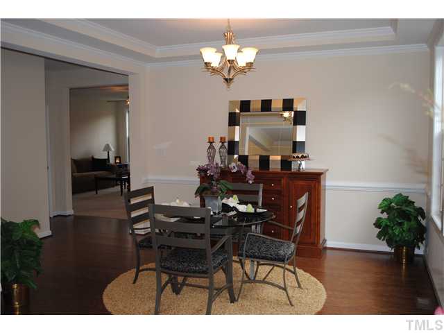 1009 Bianco Drive Raleigh, NC 27607 - Photo 5 of 12 a dining room with furniture and wooden floor