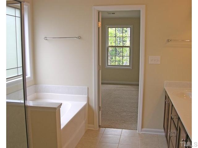 1009 Bianco Drive Raleigh, NC 27607 - Photo 7 of 12 a bathroom with a bathtub and shower