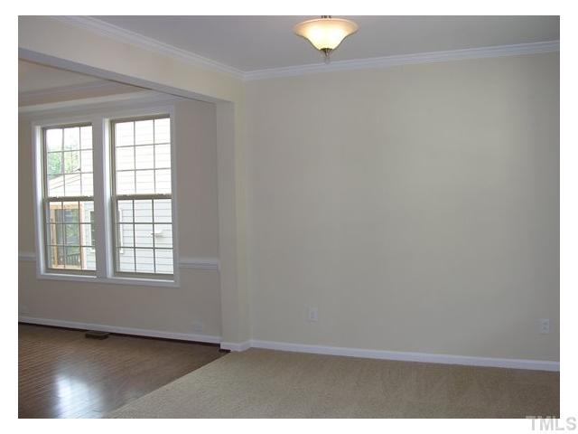 1009 Bianco Drive Raleigh, NC 27607 - Photo 8 of 12 a view of an empty room with a window