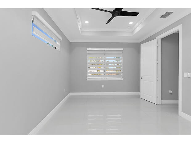 3625 54th Avenue Northeast Naples, FL 34120 - Photo 12 of 40 a view of an empty room with a window