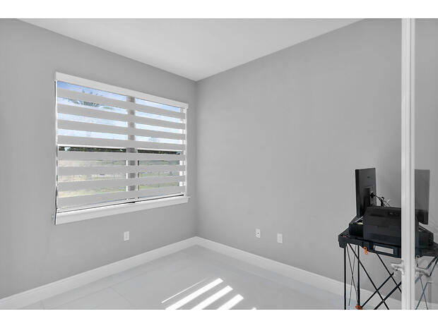 3625 54th Avenue Northeast Naples, FL 34120 - Photo 16 of 40 a view of an empty room with a window