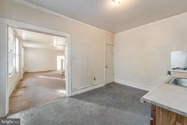 an empty room with a bathroom