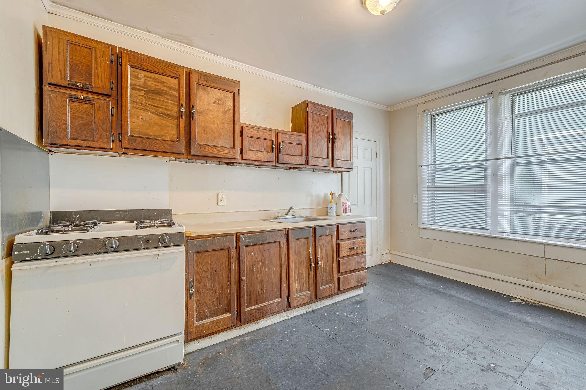 112 North 23rd Street Camden, NJ 08105 - Photo 10 of 23 a kitchen with stainless steel appliances granite countertop a stove and a sink