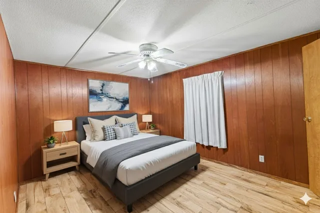 a bathroom with a sink vanity mirror and toilet