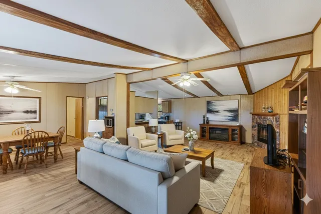 a kitchen with cabinets and wooden floor