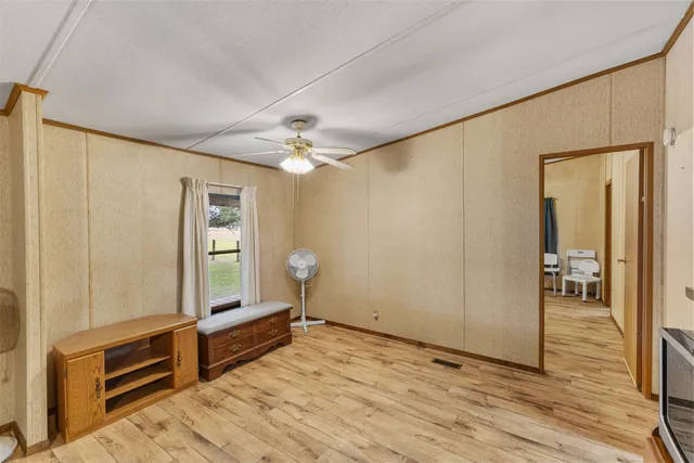 a kitchen with sink a window and cabinets