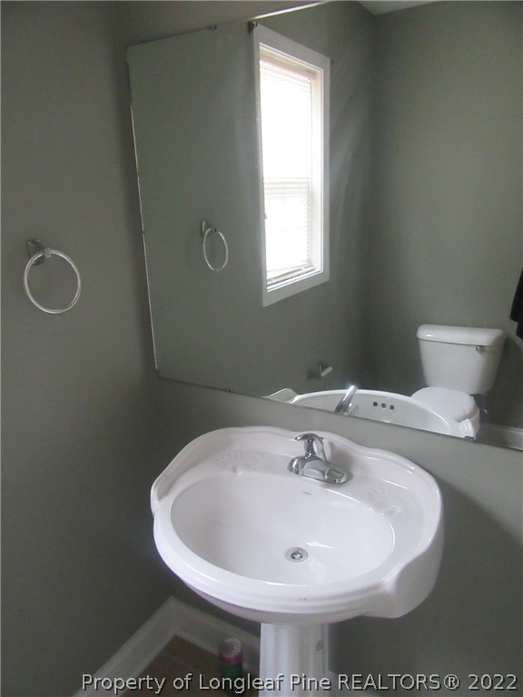 1615 Silver Ridge Court Fayetteville, NC 28304 - Photo 16 of 27 a bathroom with a sink and a toilet