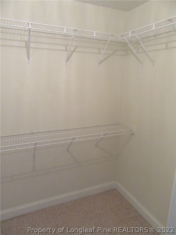 1615 Silver Ridge Court Fayetteville, NC 28304 - Photo 22 of 27 a view of a room with racks on the wall
