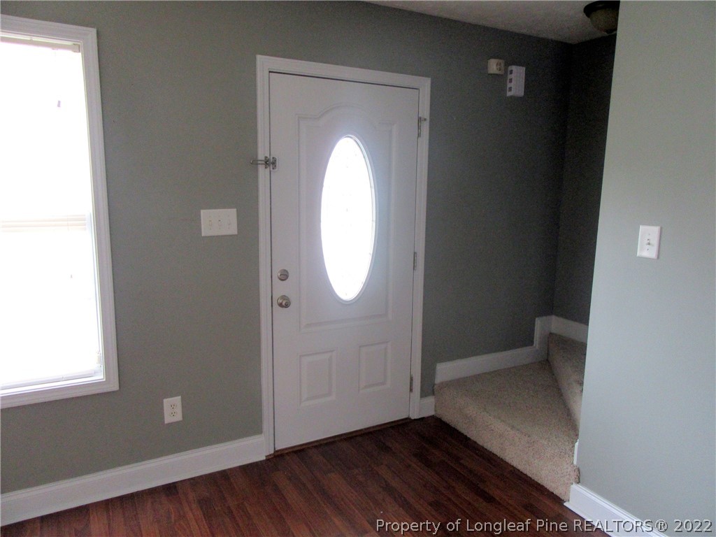 1615 Silver Ridge Court Fayetteville, NC 28304 - Photo 7 of 27 an empty room with wooden floor and windows