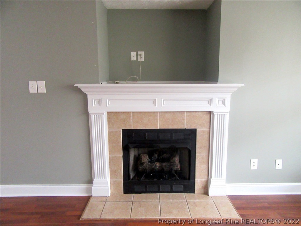1615 Silver Ridge Court Fayetteville, NC 28304 - Photo 9 of 27 a living room with a fireplace