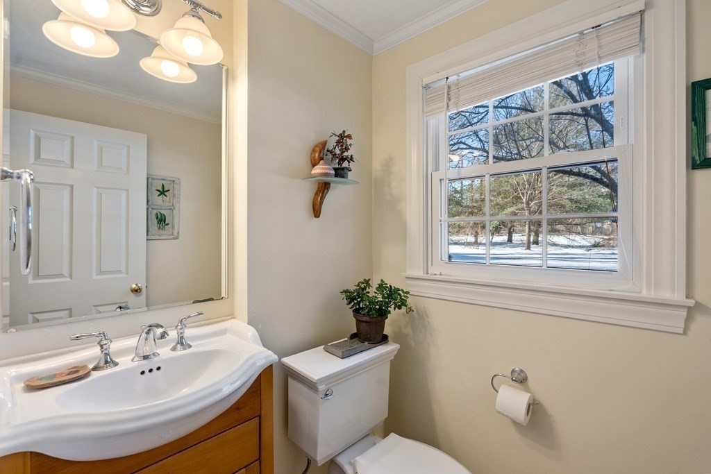 110 Victoria Road Sudbury, MA 01776 - Photo 14 of 25 a bathroom with a sink a toilet and a mirror