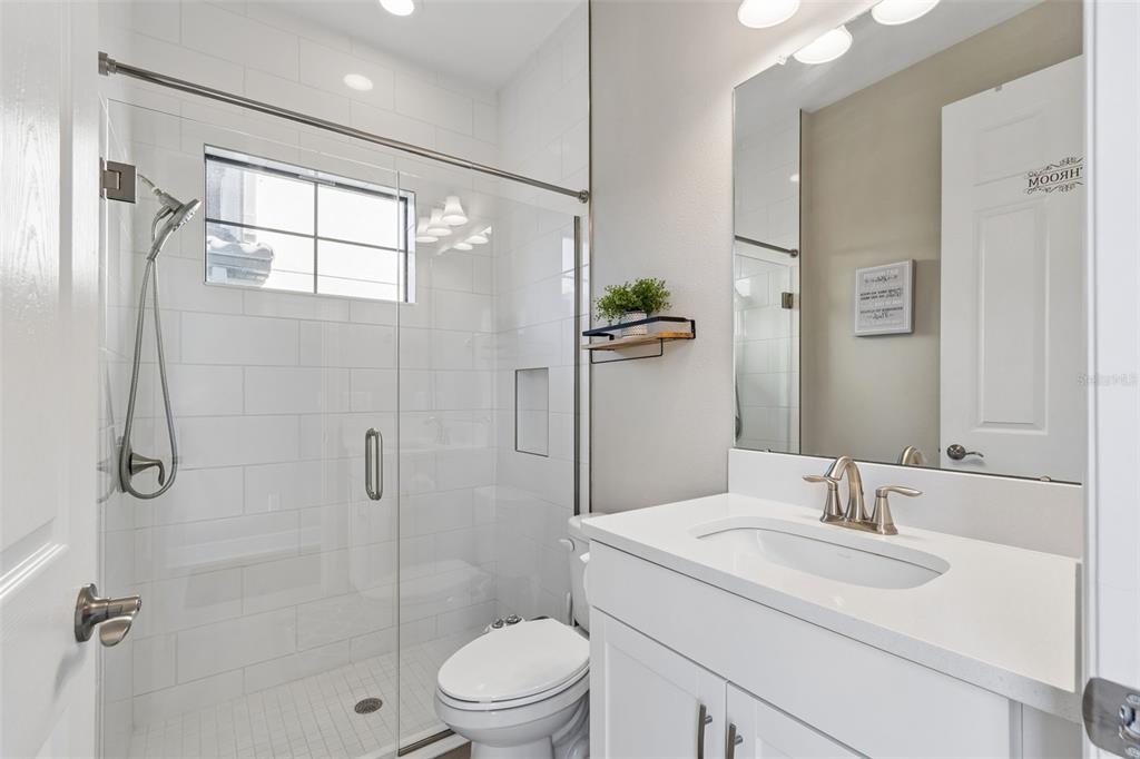 4300 Burdick Loop Odessa, FL 33556 - Photo 13 of 41 a bathroom with a sink toilet and shower