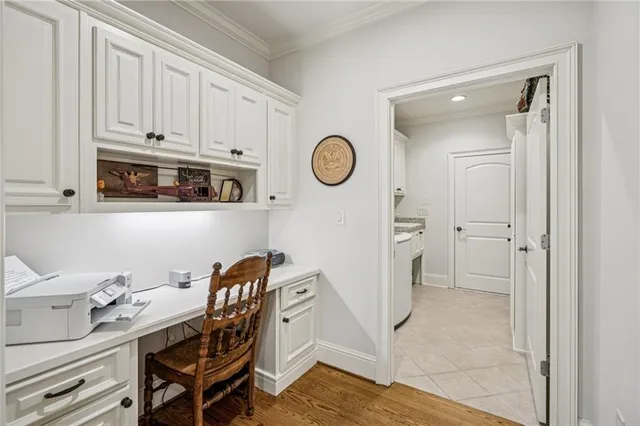 a view of a kitchen with table and chairs