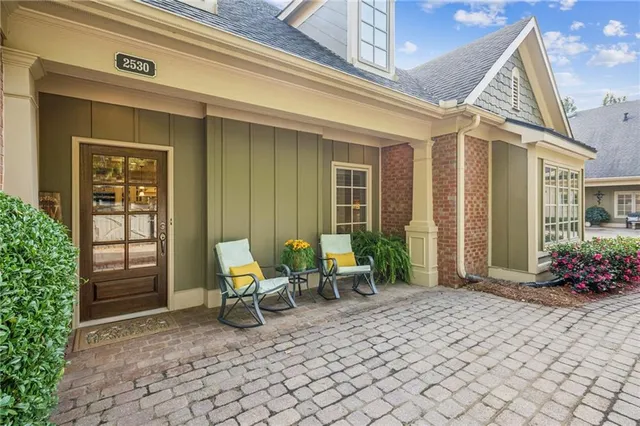 a view of a house with backyard sitting area