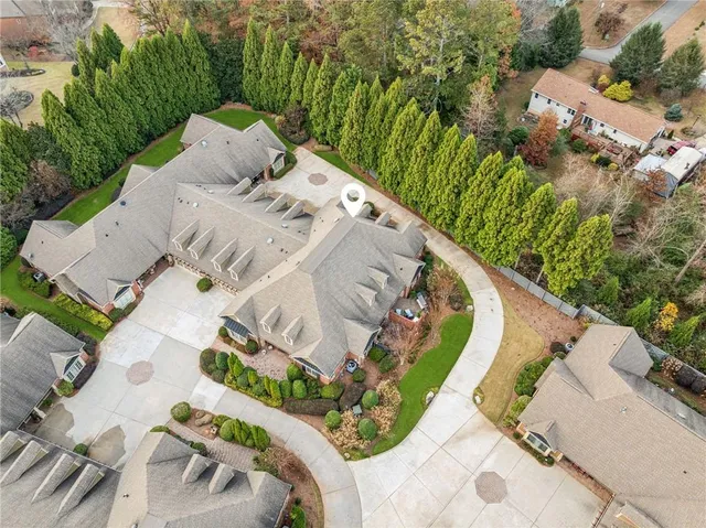 a view of a swimming pool with a yard