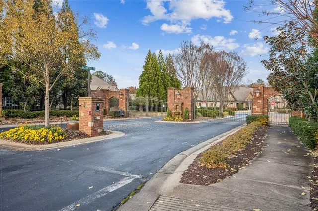 a view of a park with large trees