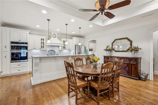 a view of a dining room with furniture and wooden floor