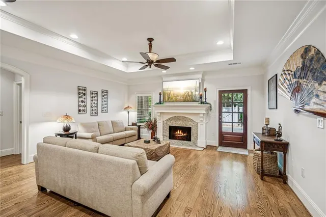 a living room with furniture fireplace and window