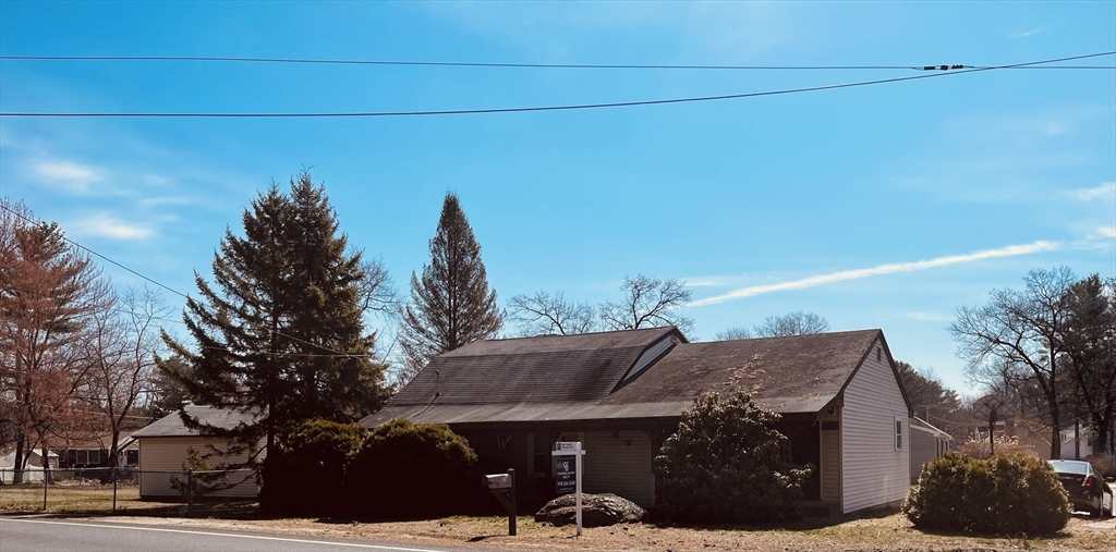 75 Frost Road Tyngsboro, MA 01879 - Photo 1 of 15 a front view of a house with garden