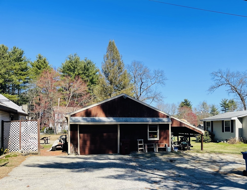 75 Frost Road Tyngsboro, MA 01879 - Photo 2 of 15 a front view of a house with a yard
