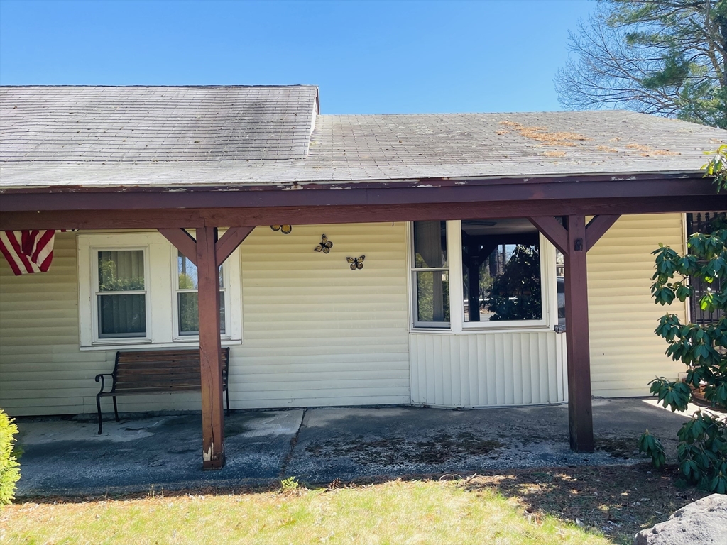 75 Frost Road Tyngsboro, MA 01879 - Photo 4 of 15 a front view of a house with a yard